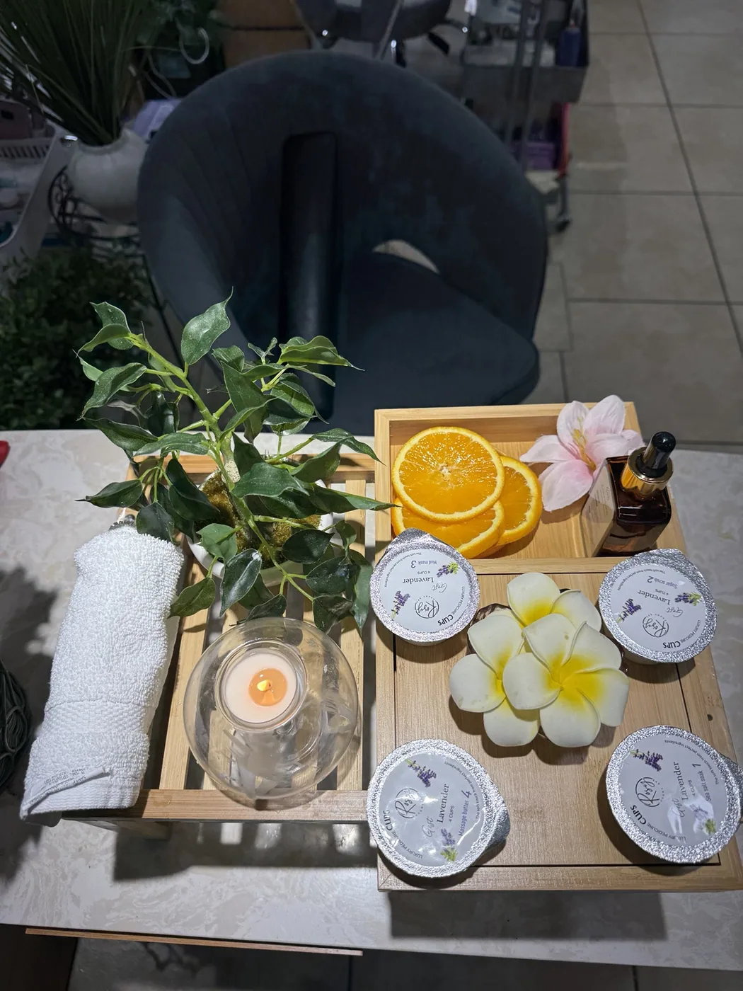 Cozy spa pedicure tray with citrus, oils and a warm candle